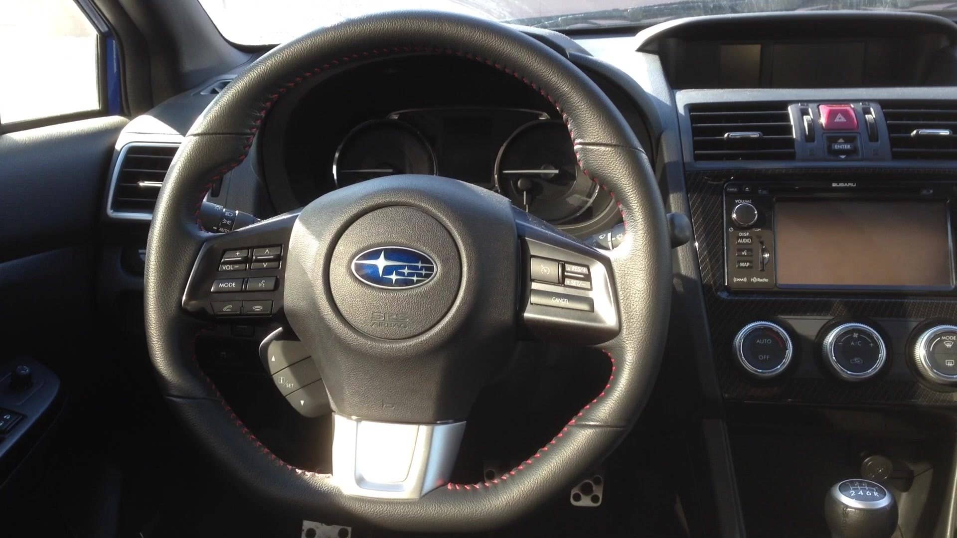Autoblog senior editor Greg Migliore explains the ins and outs of the steering wheel in the 2015 Subaru WRX.