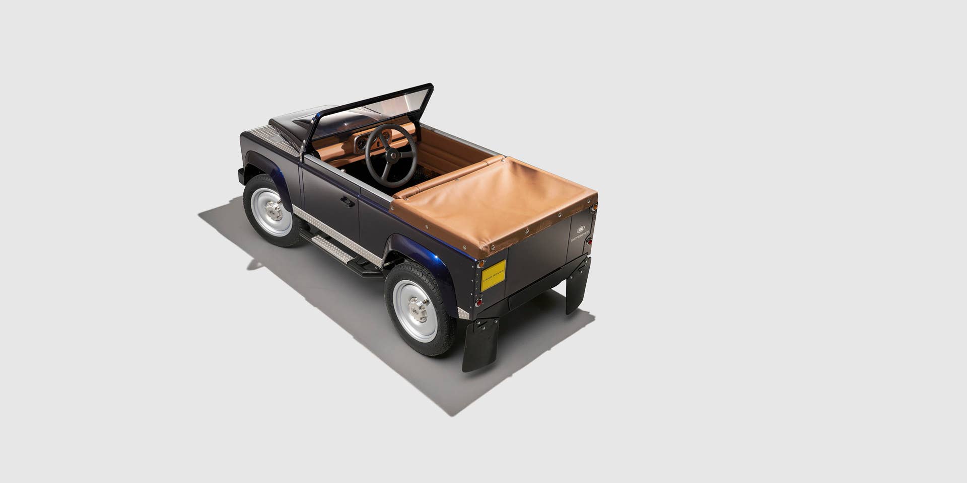 land rover defender pedal car top rear three quarters side