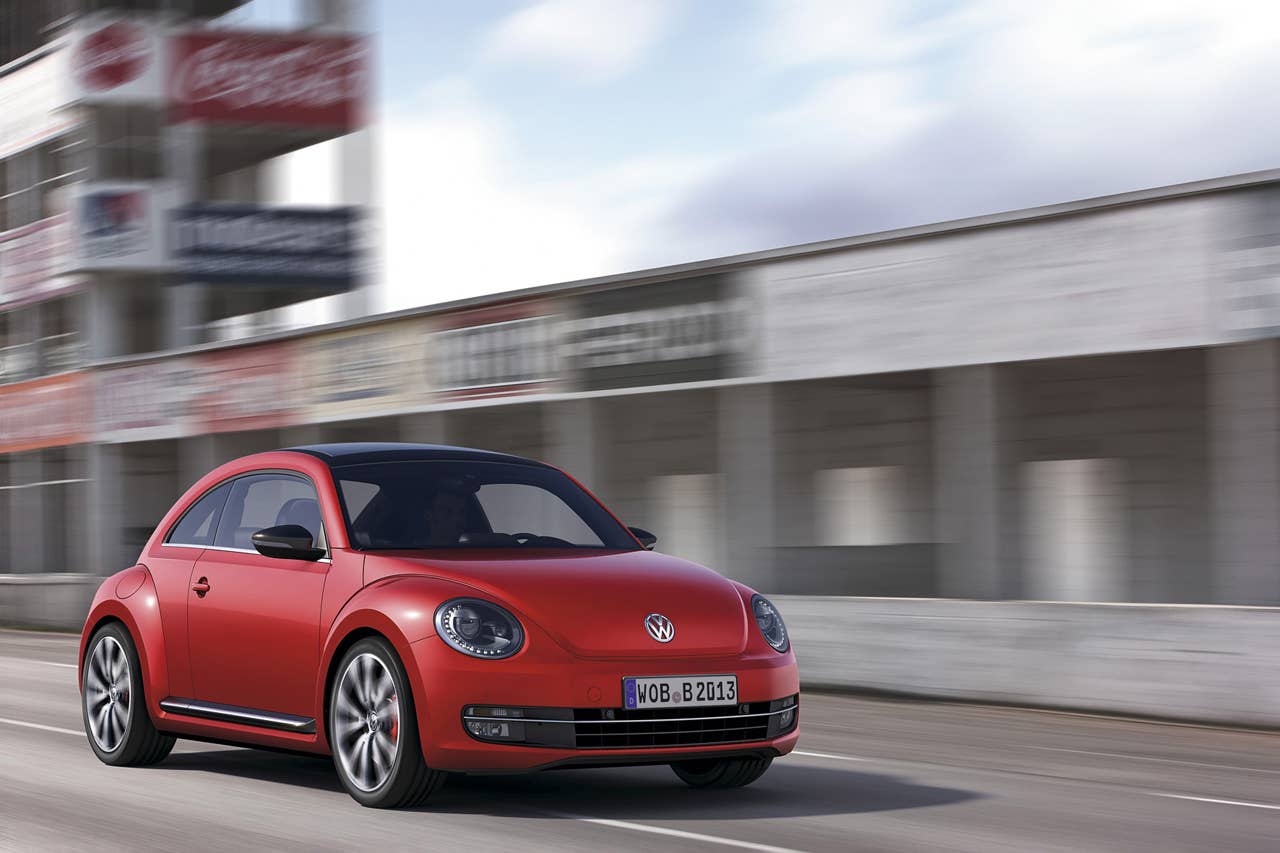 2012 Volkswagen Beetle in red, exterior in motion