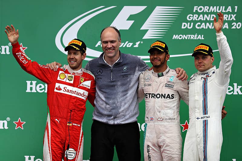 Lewis Hamilton of Great Britain and Mercedes GP celebrates on the podium with Sebastian Vettel of Germany and Ferrari and Valtteri Bottas of Finland and Williams during the Canadian Formula One Grand Prix at Circuit Gilles Villeneuve on June 12, 2016 in Montreal, Canada.