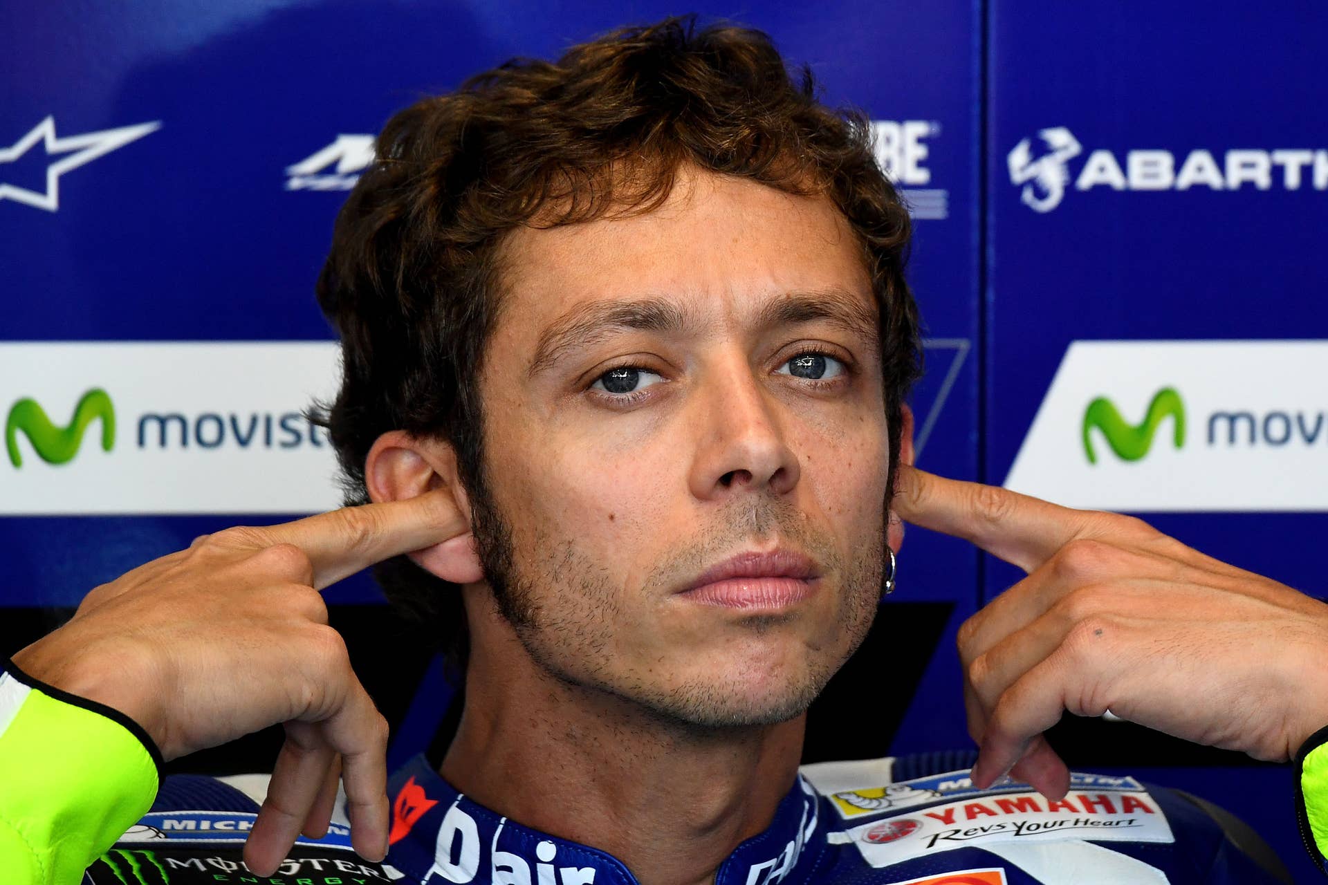 Movistar Yamaha MotoGP's Italian rider Valentino Rossi gets ready in his pit during the first practise session at the Marco Simoncelli Circuit of the San Marino Moto GP Grand Prix race in Misano, on September 9, 2016. / AFP / GABRIEL BOUYS (Photo credit should read GABRIEL BOUYS/AFP/Getty Images)