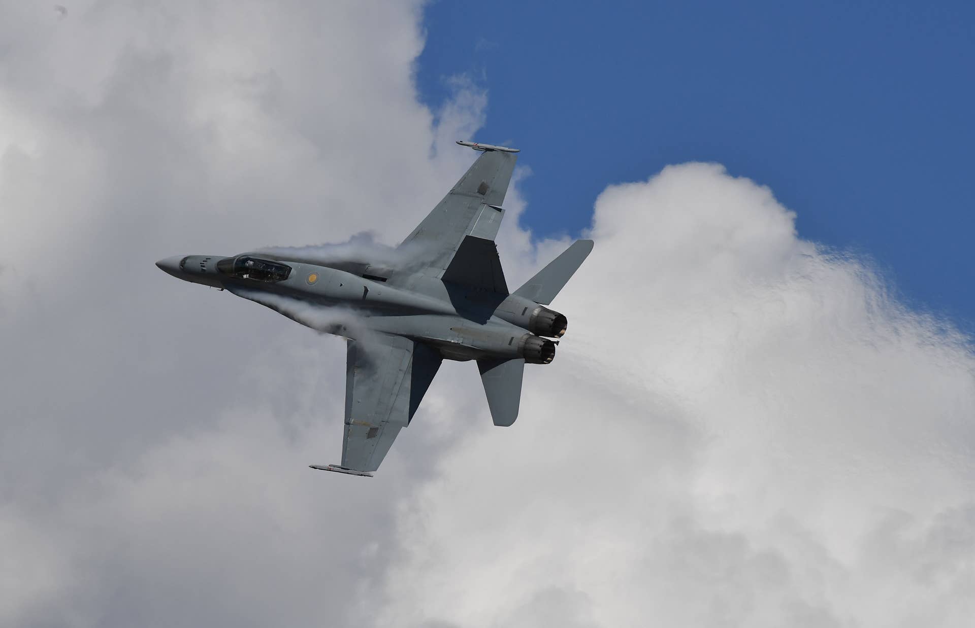 A Royal Australian Air Force FA18 performs ahead of the Formula One Australian Grand Prix in Melbourne on March 20, 2016. / AFP / Paul Crock / IMAGE RESTRICTED TO EDITORIAL USE - STRICTLY NO COMMERCIAL USE (Photo credit should read PAUL CROCK/AFP/Getty Images)