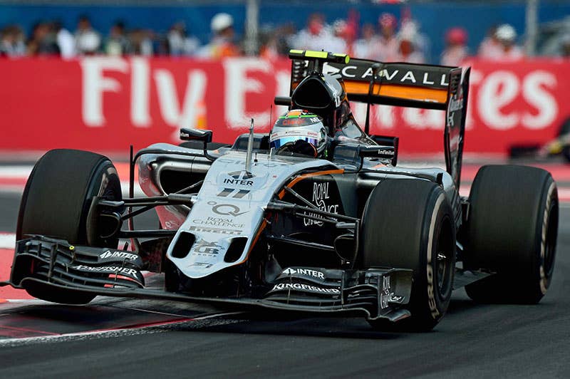 Sergio Perez goes over a curb at the 2015 Mexican Grand Prix.