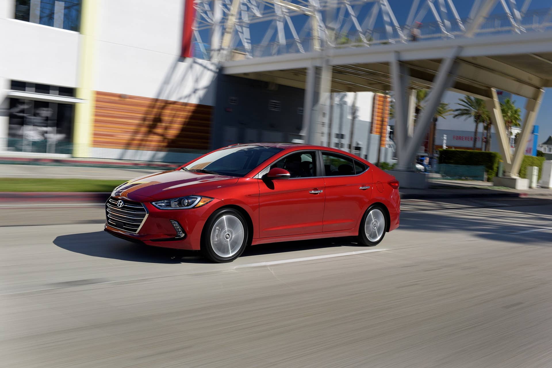2017 Hyundai Elantra sedan in red driving