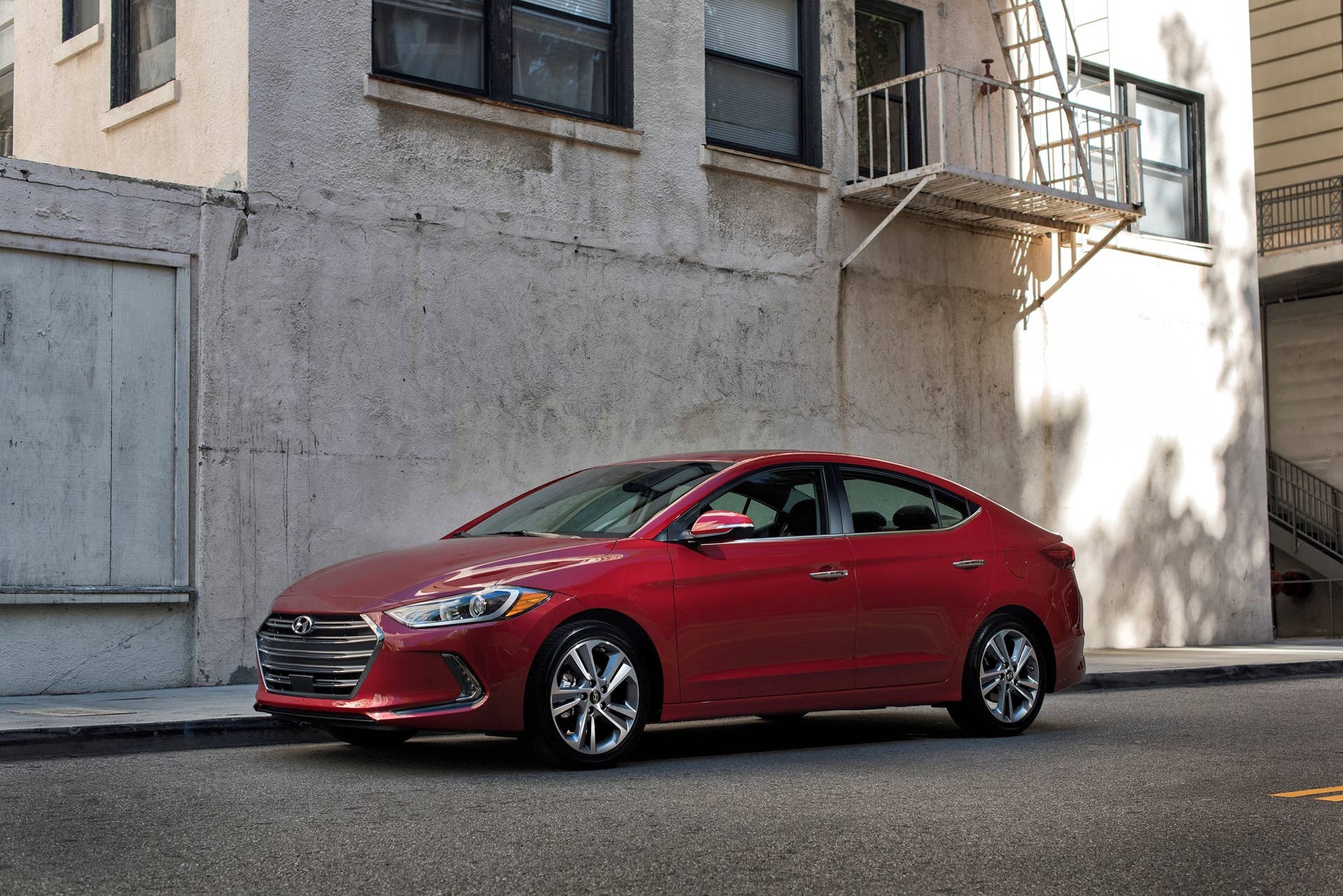 2017 Hyundai Elantra sedan in red parked
