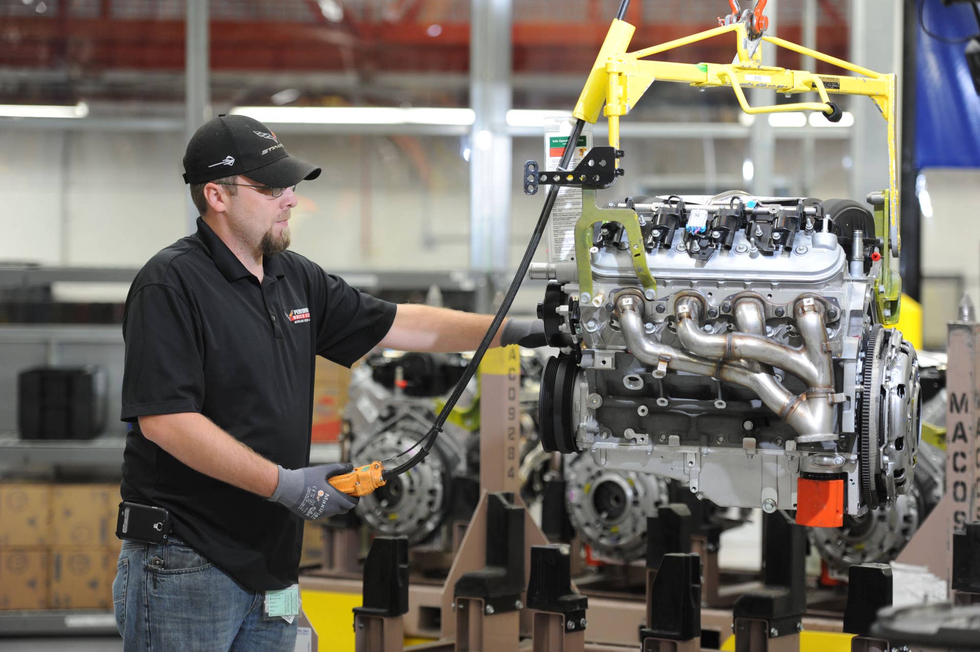 An Engine Builder weighing a completed Camaro Z/28 LS7 engine in the Performance Build Center Wednesday, October 22, 2014 at the plant in Bowling Green, Kentucky. (Photo by Joe Imel for Chevrolet)