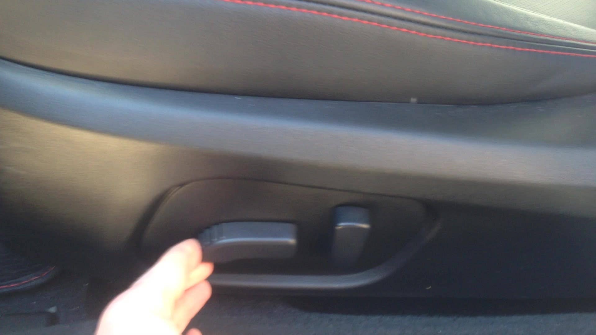 Senior editor Greg Migliore explains the driver's seat in the 2015 Subaru WRX.