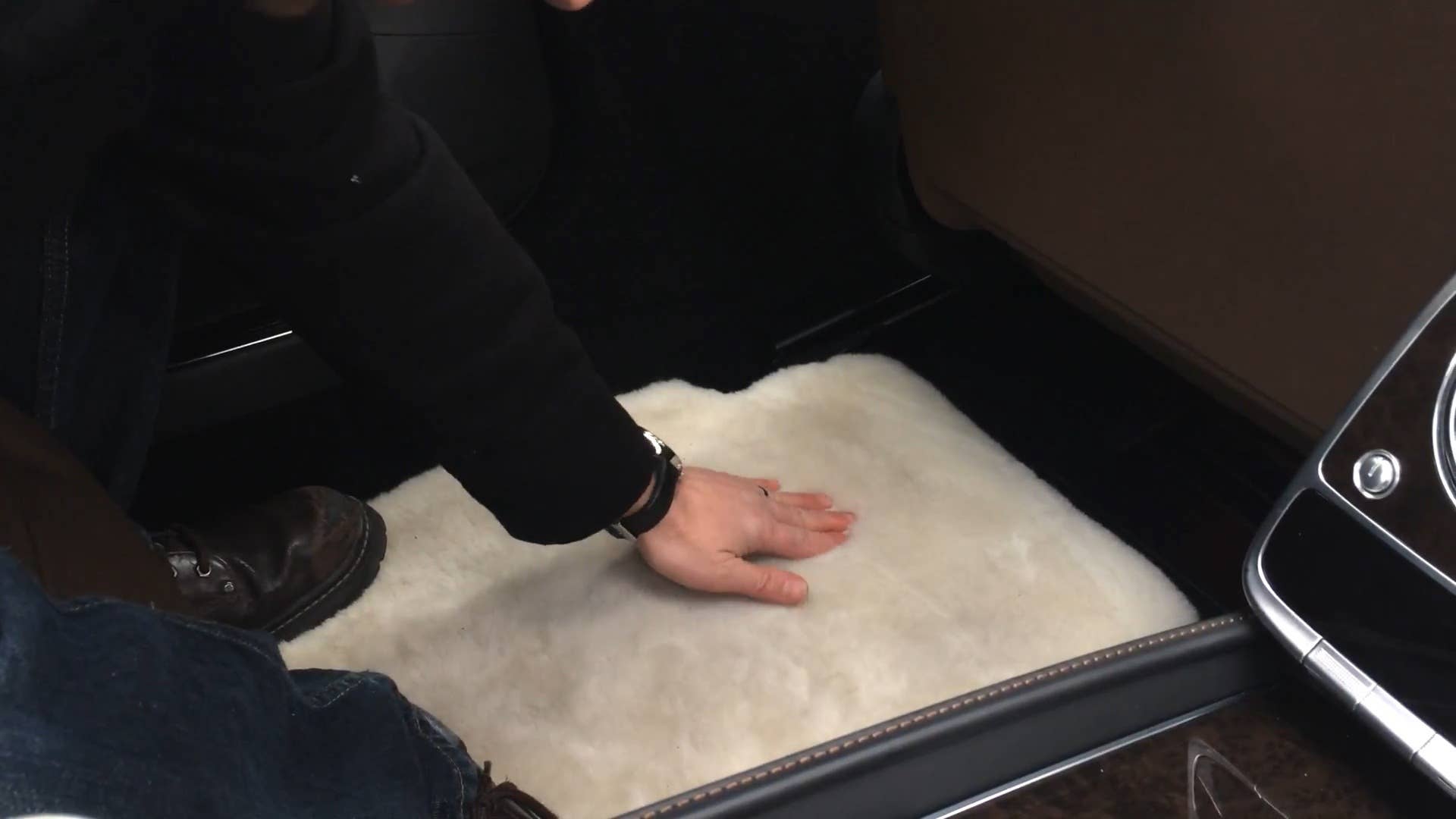 Autoblog's Greg Migliore kicks off his shoes to test out the comfort of the plush rear carpeting in the 2016 Mercedes-Maybach S600 .