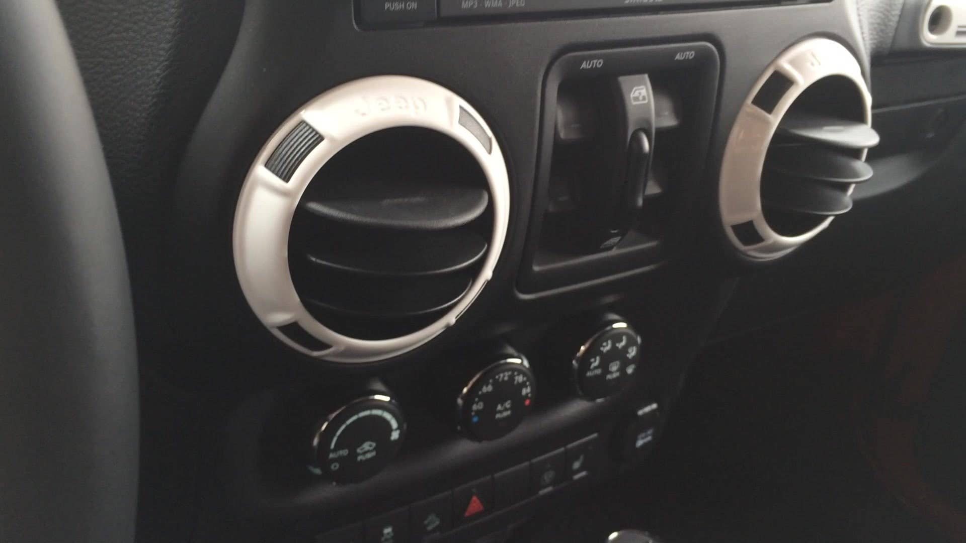 A quick look at the glossy white plastic trim on the 2015 Jeep Wrangler Unlimited X-Edition.