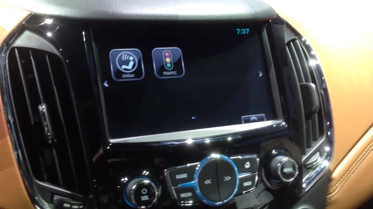 Senior editor Greg Migliore shows off the interior of the 2016 Chevy Cruze onstage at the Fillmore Detroit.