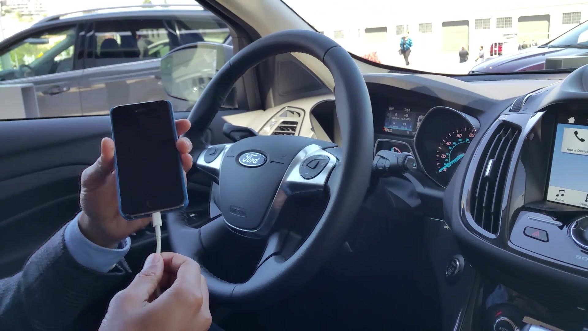 Autoblog Associate Editor Domenick Yoney gets a demonstration of the Pandora app on the new Ford Sync 3 system.