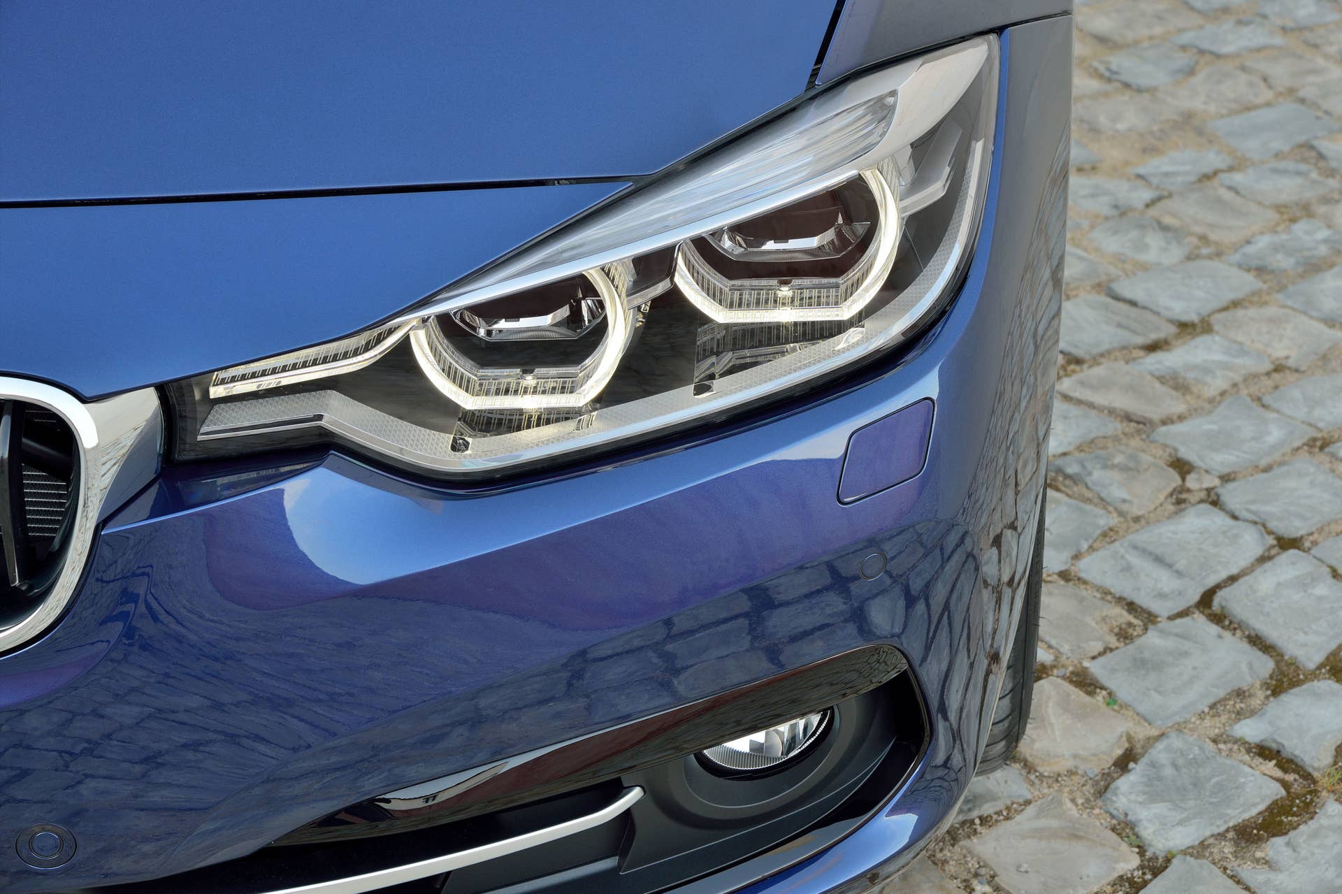 blue 2016 bmw 3 series refresh headlights closeup