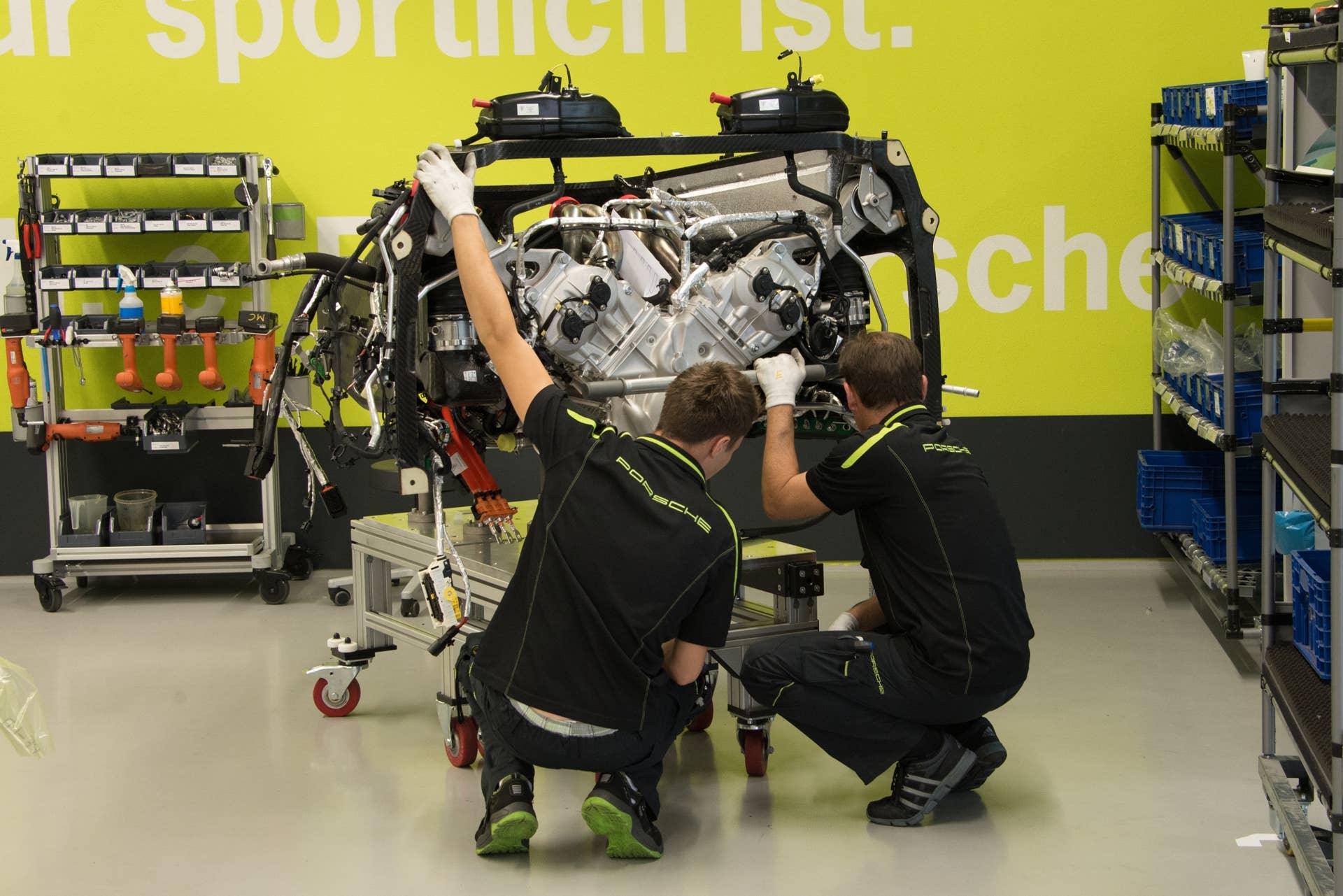 After a thorough test on a dynamometer, the engine is mounted inside the rear powertrain carrier. This very light, but stiff, structural component is made of pre-impregnated woven carbon fiber, which attaches direct to the back of the carbon-fiber monocoque passenger tub with six hefty bolts.