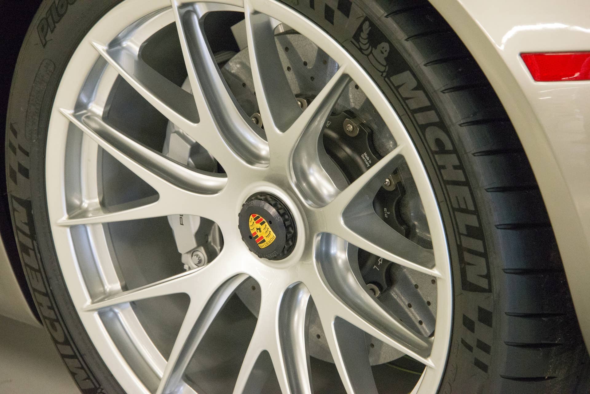 Center-lock forged magnesium wheels are part of the 918's $84,000 Weissach Package, reducing curb weight from 3,715 pounds to 3,616 pounds. Other weight-saving components include ceramic wheel bearings, titanium bolts in the chassis and lighter brakes.  Weissach package models are painted with a special coating, to protect the carbon-fiber skin, and then wrapped in vinyl (paint colors or classic racing themes— Gulf Oil, as an example) for protection.