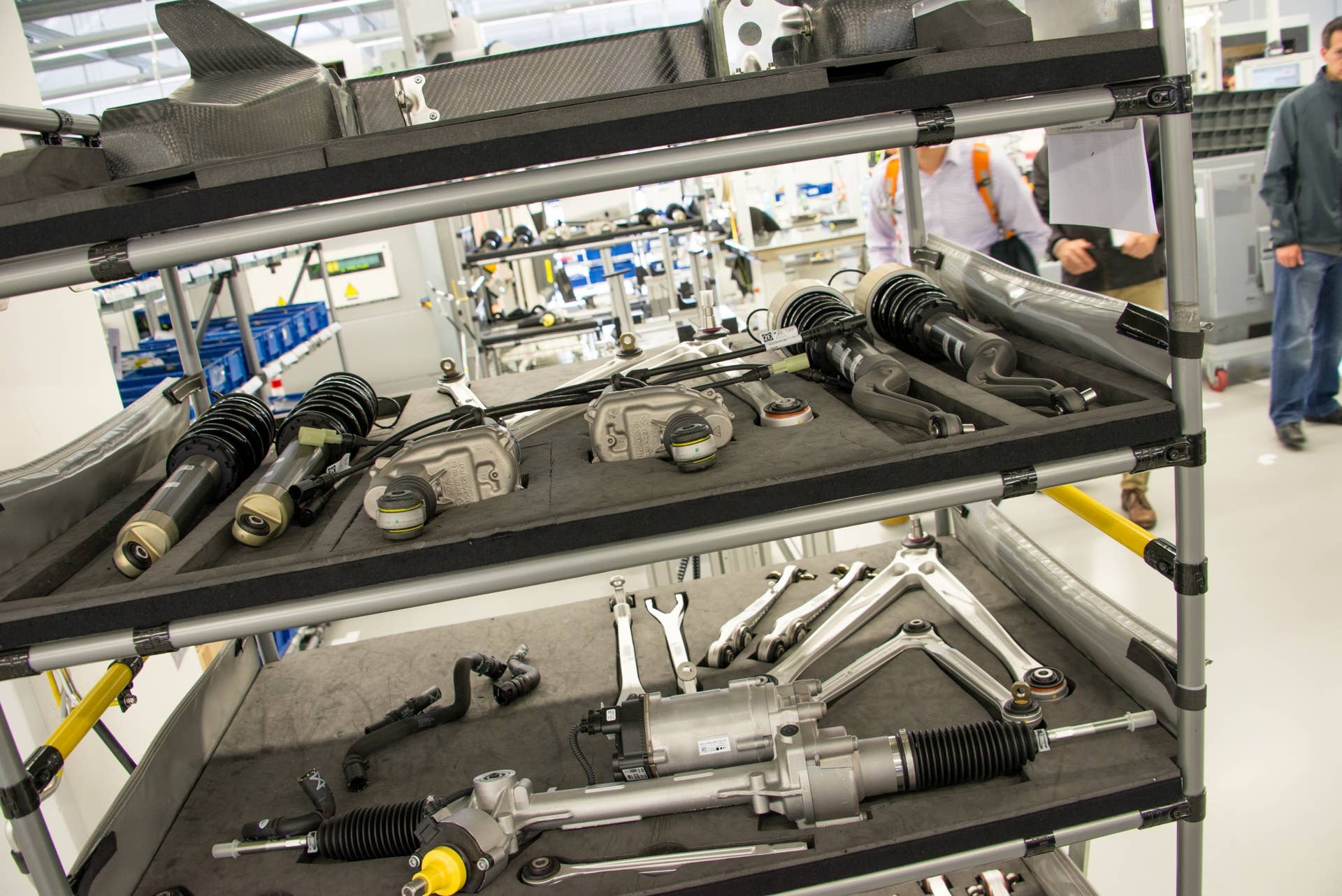 This multi-level rolling tray holds an assortment of suspension and steering components, each one set into a perfectly sized foam cutout, which will all fit on one 918 Spyder.  The items on the top rack are carbon-fiber covers, while four coil-over dampers and a couple of controls arms are on the second rack. The bottom rack contains the front steering rack and more control arms. Each item has a specific place on the tray to ensure that nothing is left out.