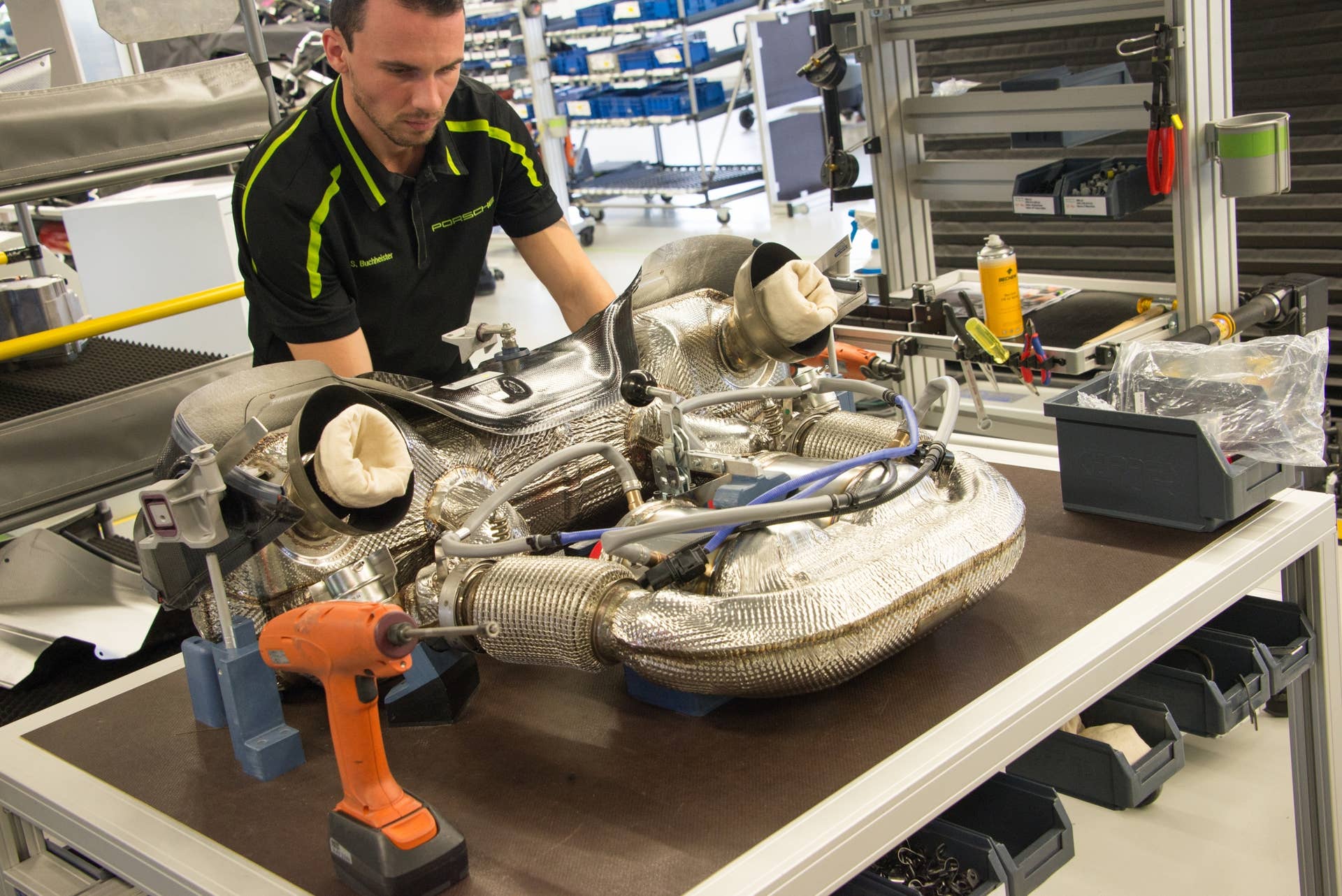 With the exception of its two exposed tips, the exhaust system is mostly hidden from view in the finished 918. The exhaust system arrives completely assembled as a unit with catalytic converters and heat shielding in place.  Constructed primarily of Inconel, an austenitic nickel-chromium-based superalloy, it is highly resistant to heat and corrosion (the material is so strong that North American Aviation constructed the skin of its X-15 rocket plane out of an Inconel alloy).