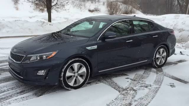 AutoblogGreen editor Sebastian Blanco drives the 2014 Kia Optima Hybrid for a week and thinks that the Optima Prime transformer hybrid might have been a better name.