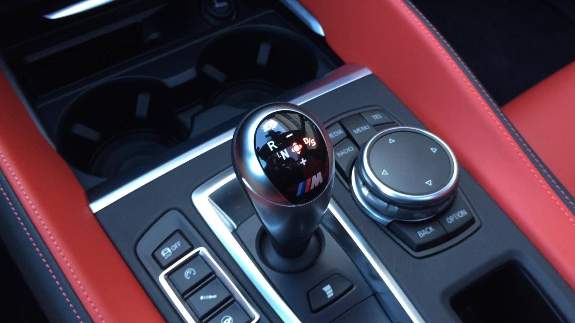 The 2015 BMW X5 M shift knob doesn't include a park gear; you simply press the start/stop ignition button, and the vehicle automatically switches to park.