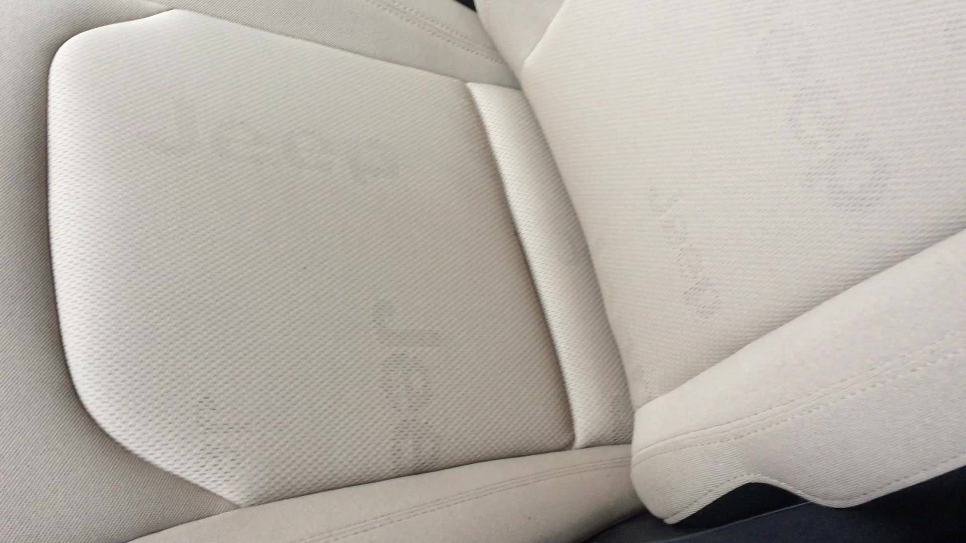 A quick look at the black and tan cloth seats in the 2015 Jeep Renegade. If you look closely, you'll see the Jeep logo printed all over the mesh seats in a subtle way.