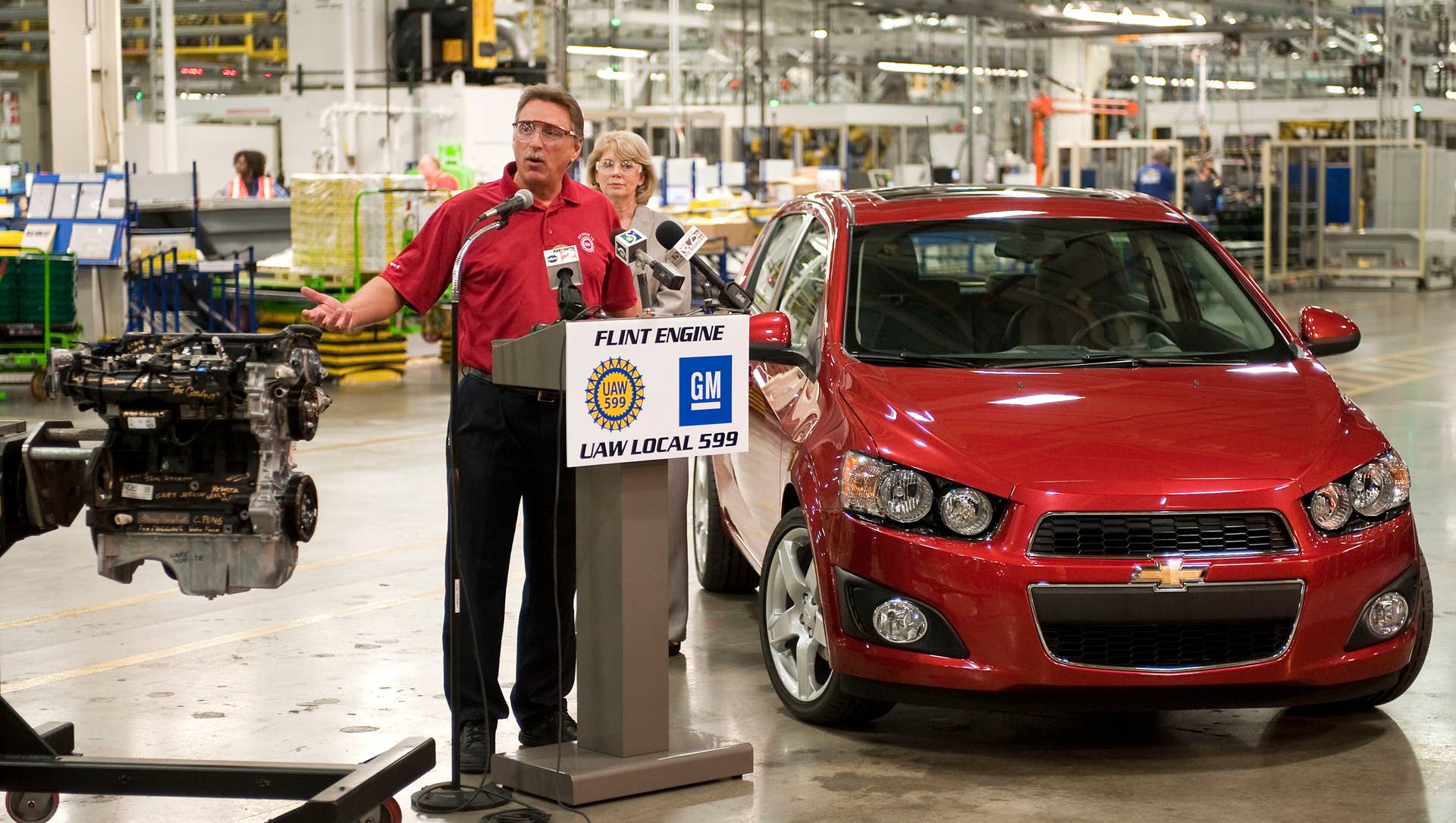 United Auto Workers - GM Vice President Norwood Jewell comments on GM's announcement that it will invest $109 million at its Flint and Bay City, Michigan facilities to support engine production for current and future fuel-efficient small cars produced for the U.S. market as Flint Engine Plant Manager Terri Burden looks on - Friday, May 13, 2011 in Flint, Michigan. The investment will protect or add 96 jobs at the two sites. GM will spend $84 million at Flint to increase 1.4-liter engine capacity. Bay City's investment of $25 million is for connecting rods and camshafts used in the engine. (Photo by Steve Fecht for General Motors) (05/13/2011)