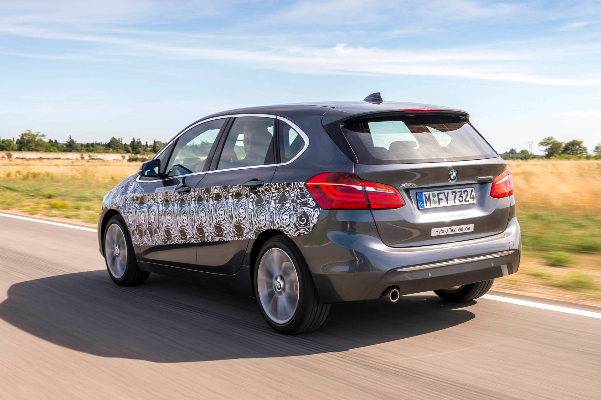 gray bmw 2 series active tourer plug-in hybrid prototype rear three quarters