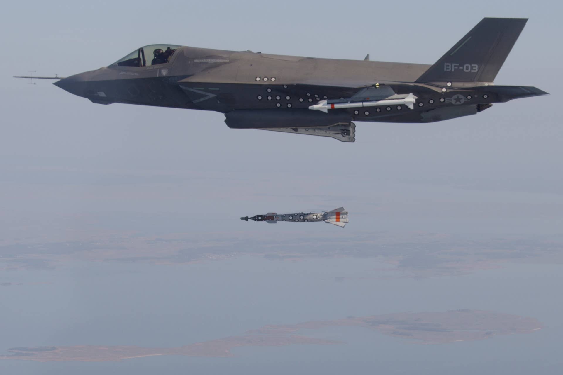F-35B test aircraft BF-3, flown by Lt. Cmdr. Michael Burks, completes the first aerial weapons release of an inert 500-pound GBU-12 Paveway II laser-guided bomb by any variant of the F-35 Lightning II aircraft. BF-3 dropped the GBU-12 over the Atlantic Test Ranges from an internal weapons bay. The F-35B is the variant of the Lightning II designed for use by the U.S. Marine Corps, as well as F-35 international partners in the United Kingdom and Italy. The F-35B is capable of short takeoffs and vertical landings to enable air power projection from amphibious ships, ski-jump aircraft carriers and expeditionary airfields. The F-35B is undergoing flight test and evaluation at NAS Patuxent River, Md., prior to delivery to the fleet. (U.S. Navy photo courtesy of Lockheed Martin by Layne Laughter)