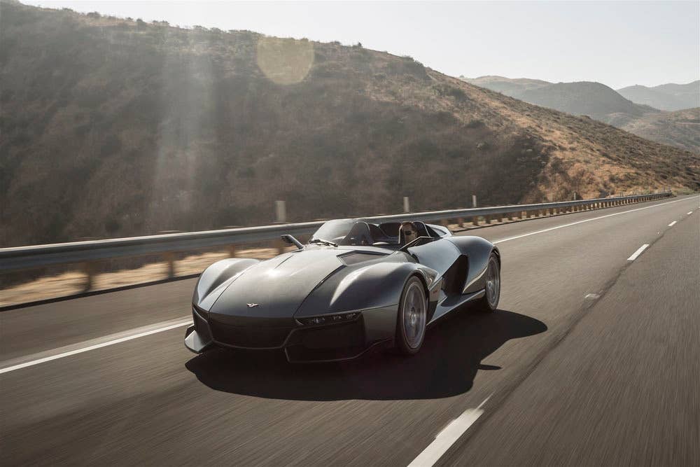 gray rezvani motors beast on the road in shadow