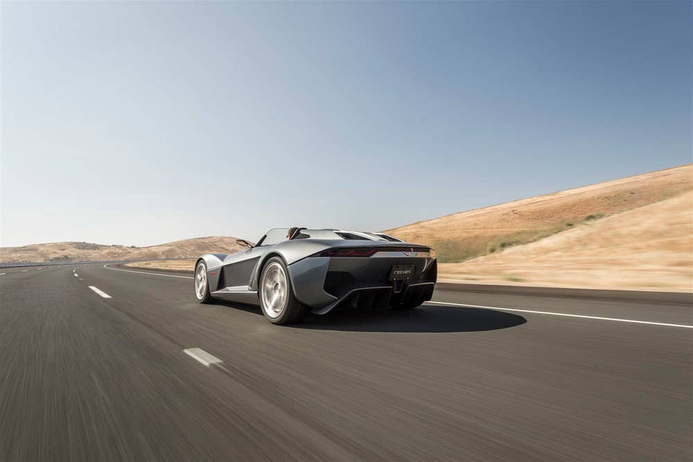 gray rezvani motors beast low angle rear further back desert