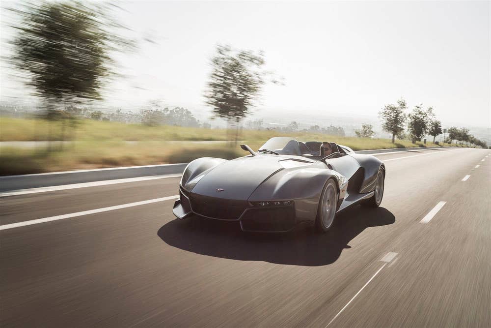 gray rezvani motors beast in the sun on the road