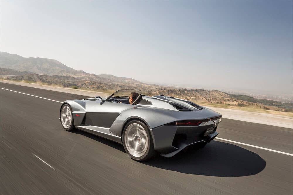 gray rezvani motors beast on the road side