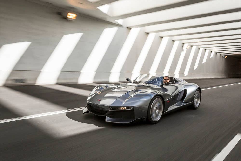 gray rezvani motors beast through a bridge