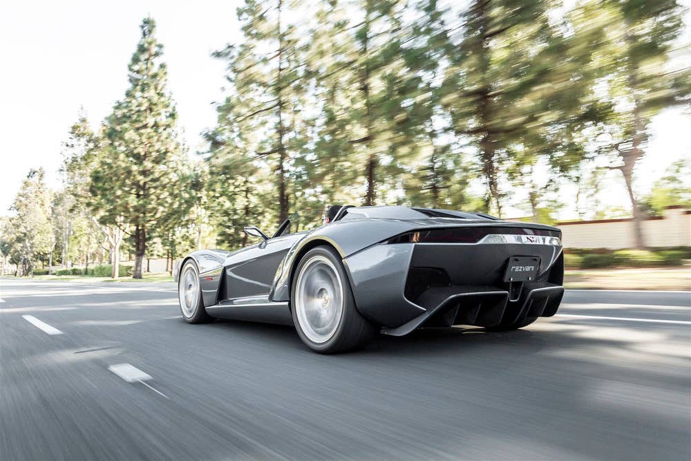 gray rezvani motors beast low angle rear on the road