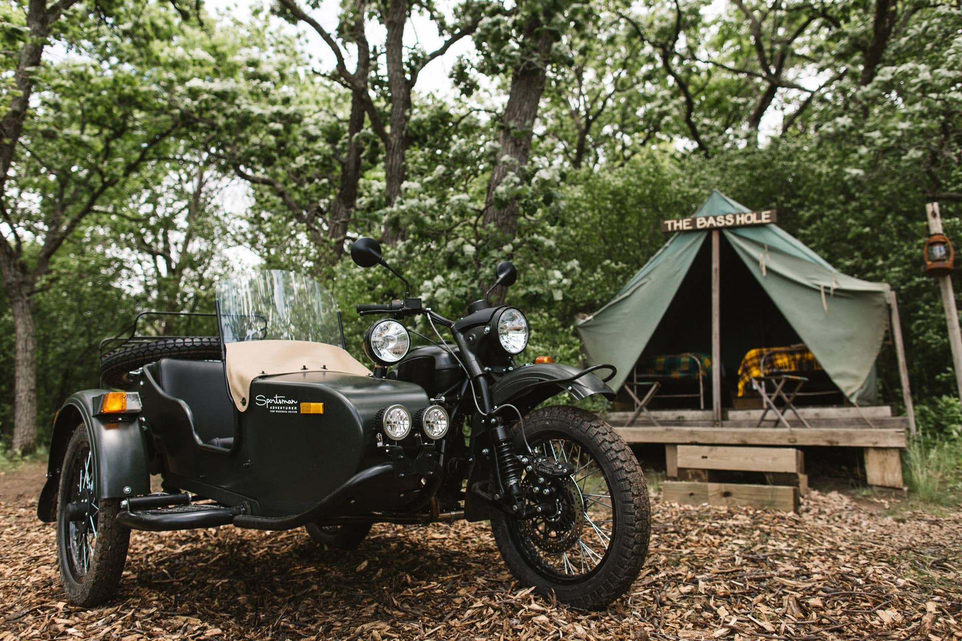 green ural motorcycles sportsman at camp