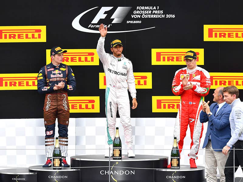Red Bull driver Max Verstappen, left, Mercedes driver, winner Lewis Hamilton, center, and Ferrari driver Kimi Raikkonen, of Finland, celebrate after the Formula One Grand Prix, at the Red Bull Ring racetrack in Spielberg, southern Austria, Sunday, July 3, 2016. Lewis Hamilton pushed past Mercedes teammate Nico Rosberg on the final lap to win the Austrian Grand Prix on Sunday. Max Verstappen in a Red Bull was second and Kimi Raikkonen of Ferrari was third.