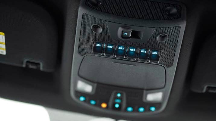 The all-new F-150 Raptor houses auxiliary switches to control aftermarket equipment such as lights or an air compressor out of the driverÃ¢Â€Â™s way mounted in the cabÃ¢Â€Â™s overhead console, similar to a fighter plane.
