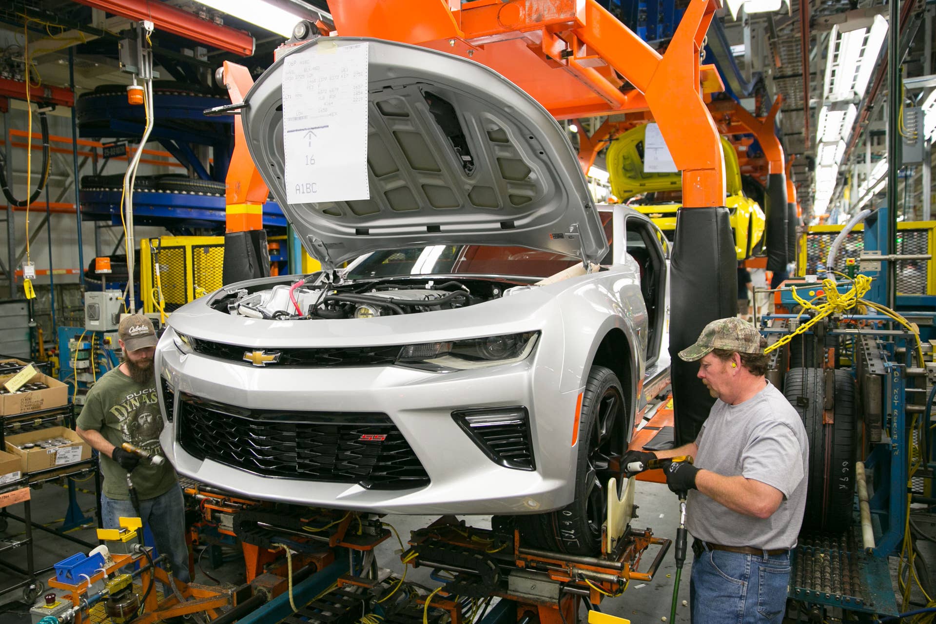 Larry Conarton, right, and Ben Spedoske install wheels and tires on a pre-production 2016 Chevrolet Camaro for testing Thursday, May 28, 2015 at the General Motors Lansing Grand River Assembly Plant in Lansing, Michigan, where GM announced today it will invest $175 million for new tooling and equipment to build the sixth-generation Chevrolet Camaro - and the return of hundreds of workers to build Americaâs best-selling performance car for the last five years. (Photo by John F. Martin for General Motors)