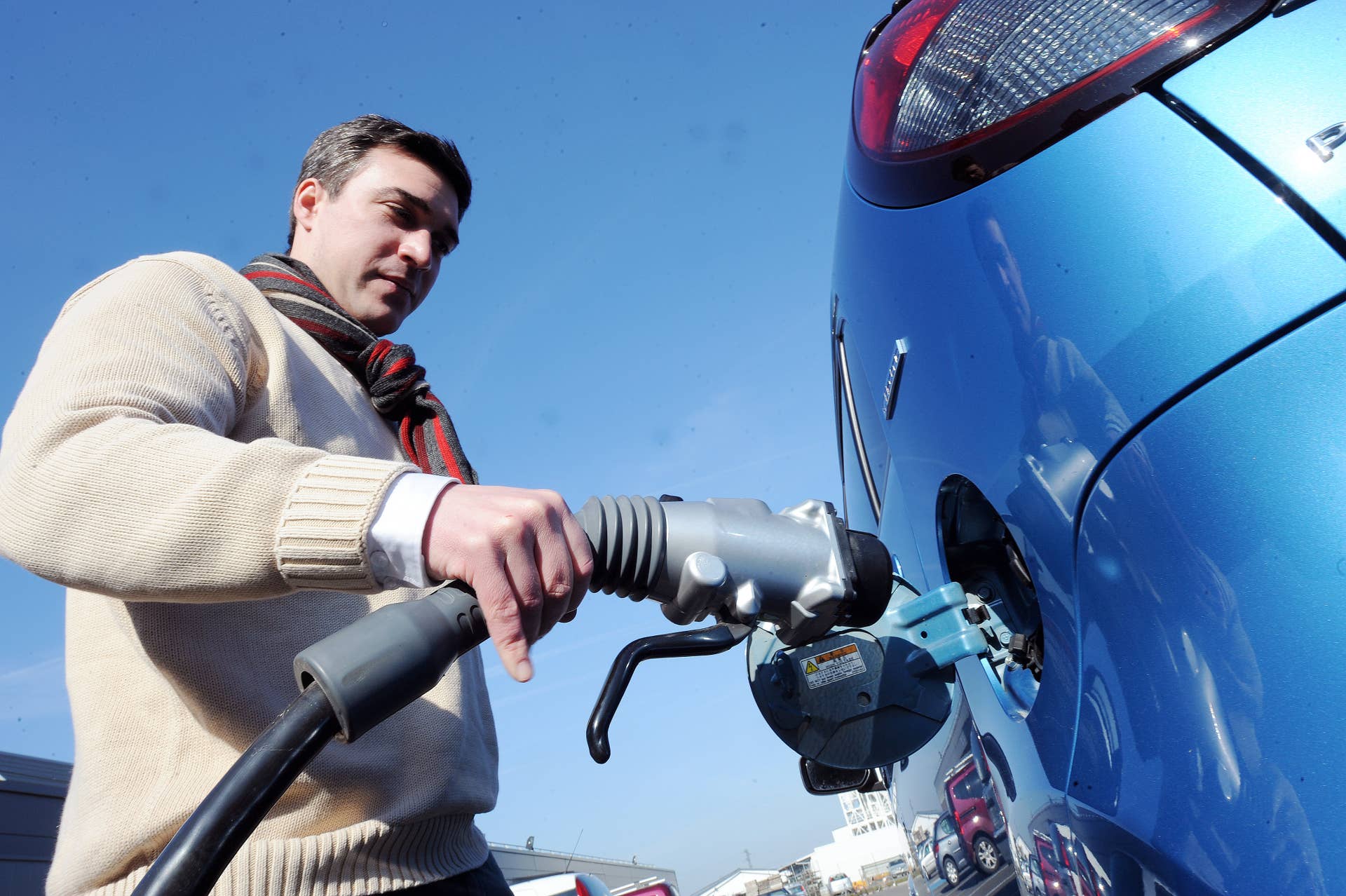 Jerome Deniaud, SGTE-POWER technical manager of the 'CHAdeMO' quick charger project, loads a car with CHAdeMO quick charger on a production line on February 19, 2013 at the SGTE-POWER factory in Le Mans, western France. Boasting fifty years of experience in the production of battery chargers, the SGTE-Power company became in 2010 the first European manufacturer to commercialize European Fast chargers called 'CHAdeMO' throughout Europe in partnership with car manufacturers and oil companies. 250 Quick chargers made by SGTE Power were installed so far, representing 20 percent of the global market. 'CHAdeMO' chargers offer the possibility to charge 80 percent of the battery in less than 30 minutes, supplying energy to electric can for 22 hours and 50 minutes per day during 300 km, instead of 16 hours and 100 km with classical chargers. AFP PHOTO JEAN-FRANCOIS MONIER (Photo credit should read JEAN-FRANCOIS MONIER/AFP/Getty Images)