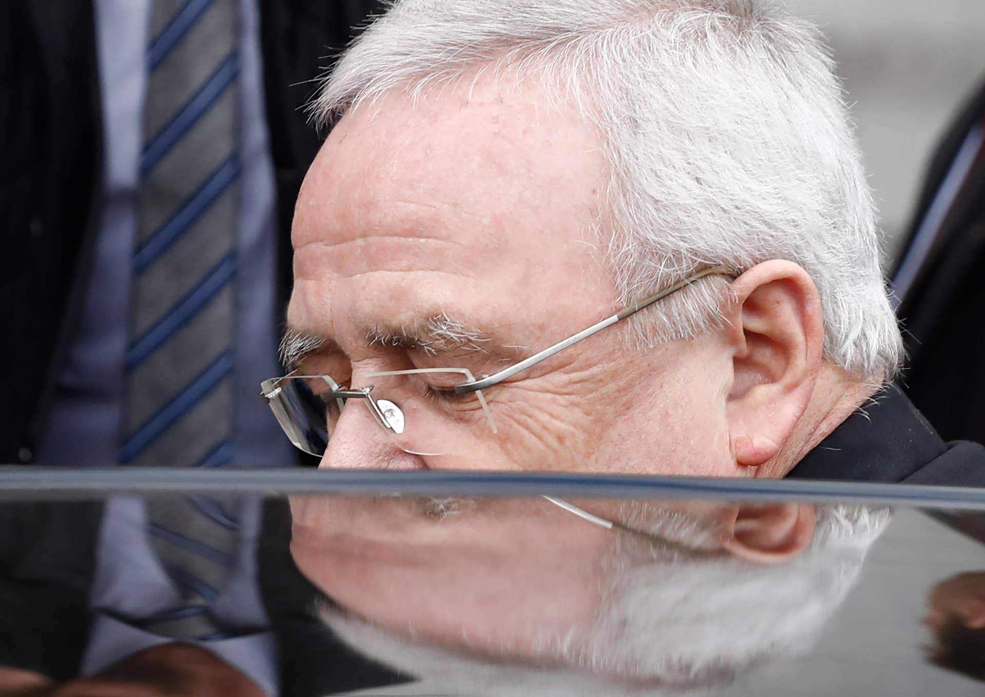 Former Volkswagen boss Martin Winterkorn gest into his car as he leaves the Bundestag (Lower house of parliament) compound, on January 19, 2017 in Berlin, where he faced a parliamentary committee investigating the 'dieselgate' scandal. Winterkorn said that he did not know the beleaguered German auto giant was engaging in systematic emissions cheating until shortly before the scam broke. / AFP / Odd ANDERSEN (Photo credit should read ODD ANDERSEN/AFP/Getty Images)