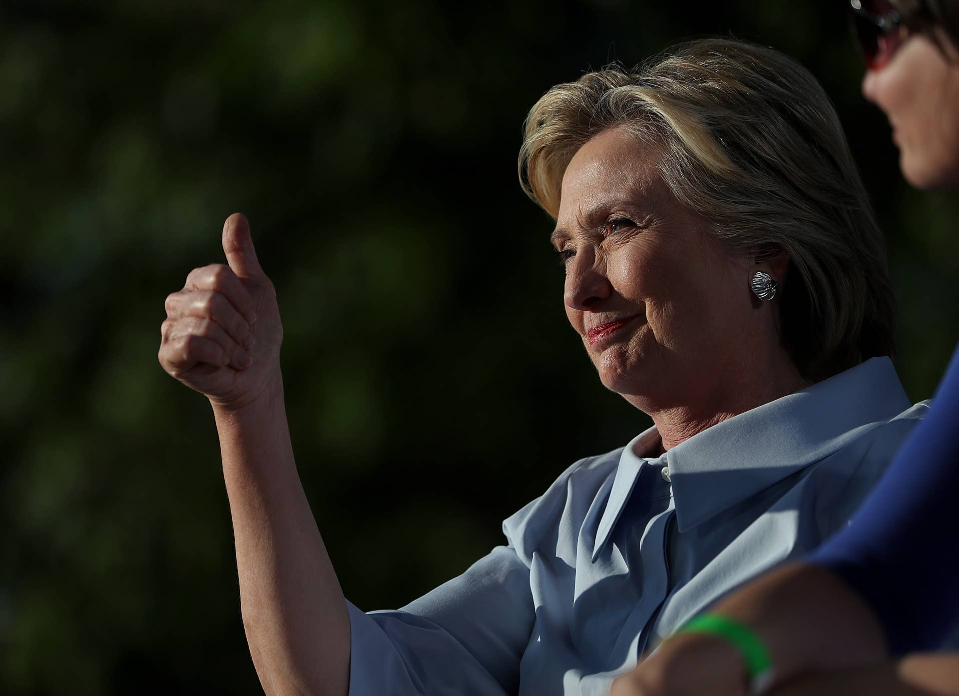 HAMPTON, IL - SEPTEMBER 05: Democratic presidential nominee Hillary Clinton gives the thumbs-up at the 49th annual Salute to Labor on September 5, 2016 in Hampton, Illinois. Clinton is kicking off a Labor Day campaign swing to Ohio and Iowa on a new campaign plane. (Photo by Justin Sullivan/Getty Images)
