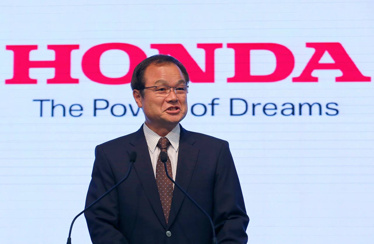 Honda Motor Co. President Takanobu Ito speaks during a joint press conference with McLaren Group Ltd. CEO Martin Whitmarsh at the Japanese automaker's headquarters in Tokyo, Thursday, May 16, 2013. Honda is returning to Formula One in 2015 as an engine supplier to McLaren, recreating a partnership that was dominant in the 1980s and 1990s. Ito announced the decision, reversing the decision made in 2008 to pull out of the expensive sport due to the effects of the global financial crisis. (AP Photo/Shizuo Kambayashi)
