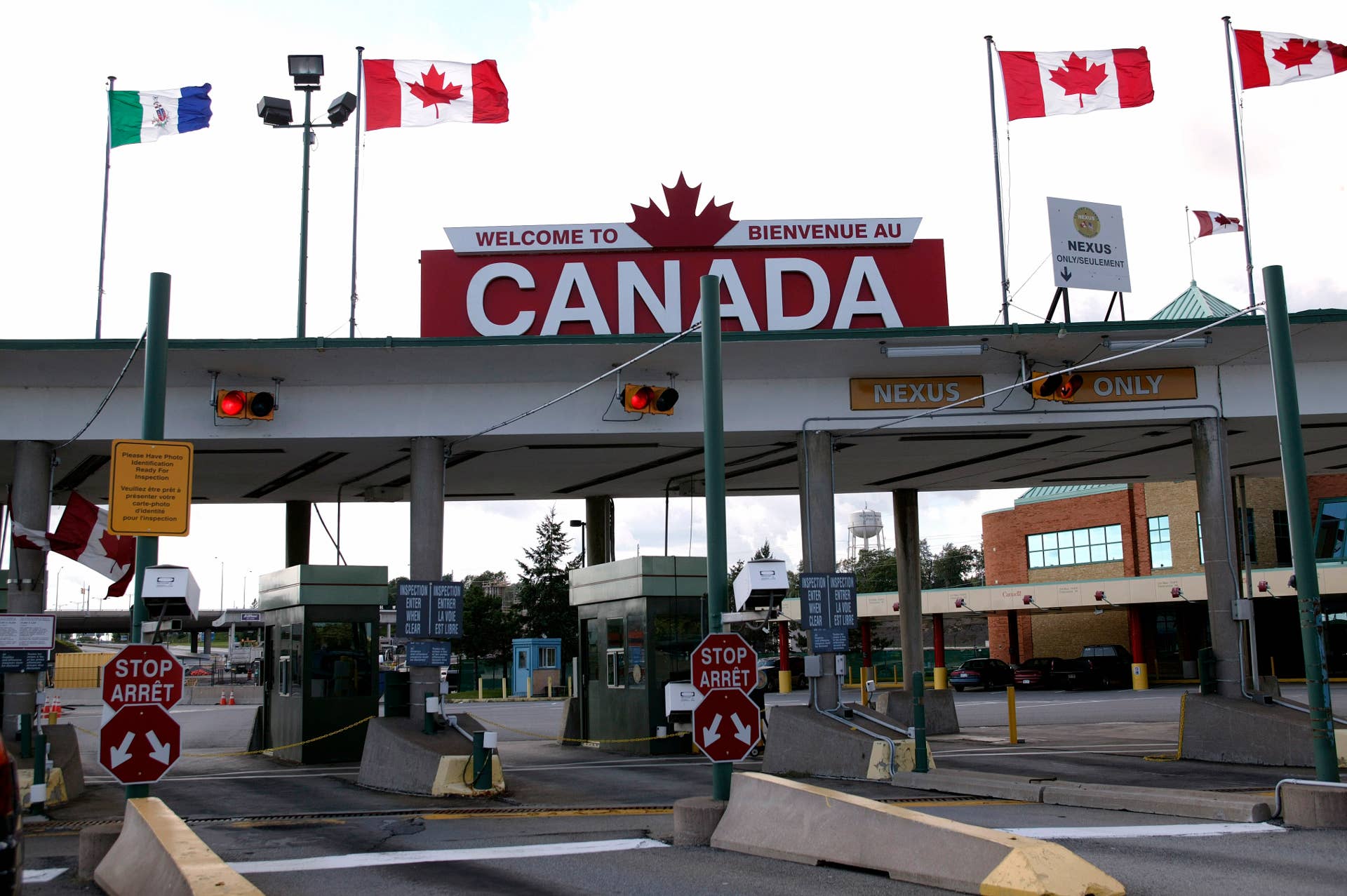 FORT ERIE, ONTARIO - SEPTEMBER 20: (NEWSWEEK AND US NEWS AND WORLD REPORT OUT) People wait to clear the Customs and Immigration plaza before or after crossing the Peace Bridge on September 20, 2005 in Buffalo, New York. Nearly 3.2 million trucks, buses and cars cross the Peace Bridge each year. It is one of the busiest commercial crossings along the entire Canadian-U.S. border. Trade between the U.S. and Canada totaled $500 billion usd in 2005. (Photo by Robert Nickelsberg/Getty Images)