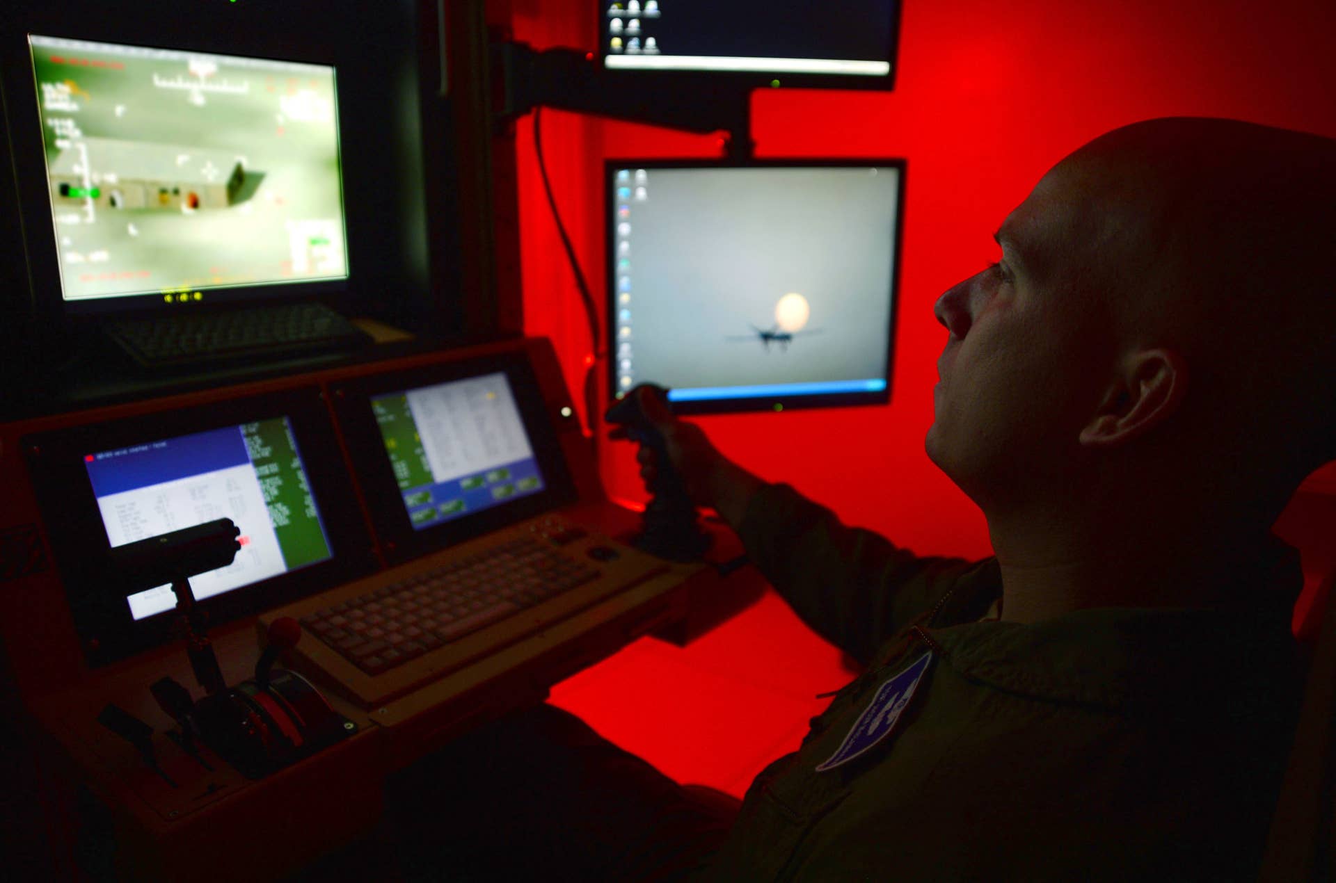 Tech. Sgt. Jason, 91st Attack Squadron sensor operator, flies a simulated training mission on an MQ-9 Reaper at Creech Air Force Base, Nev., May 8, 2014. The 91st ATKS was recently awarded the 2013 Grover Loening Trophy, which represents the current benchmark for the nation's overall outstanding aviation program (Last name withheld for security purposes). (U.S. Air Force photo by Staff Sgt. N.B./Released)