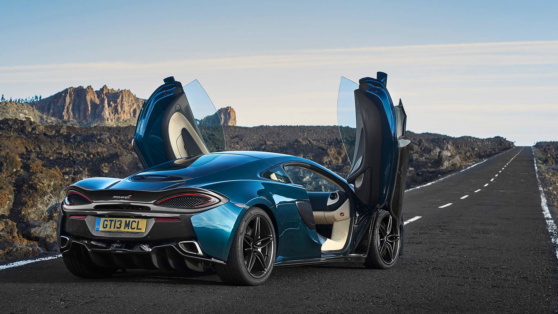 2017 McLaren 570GT rear 3/4 view