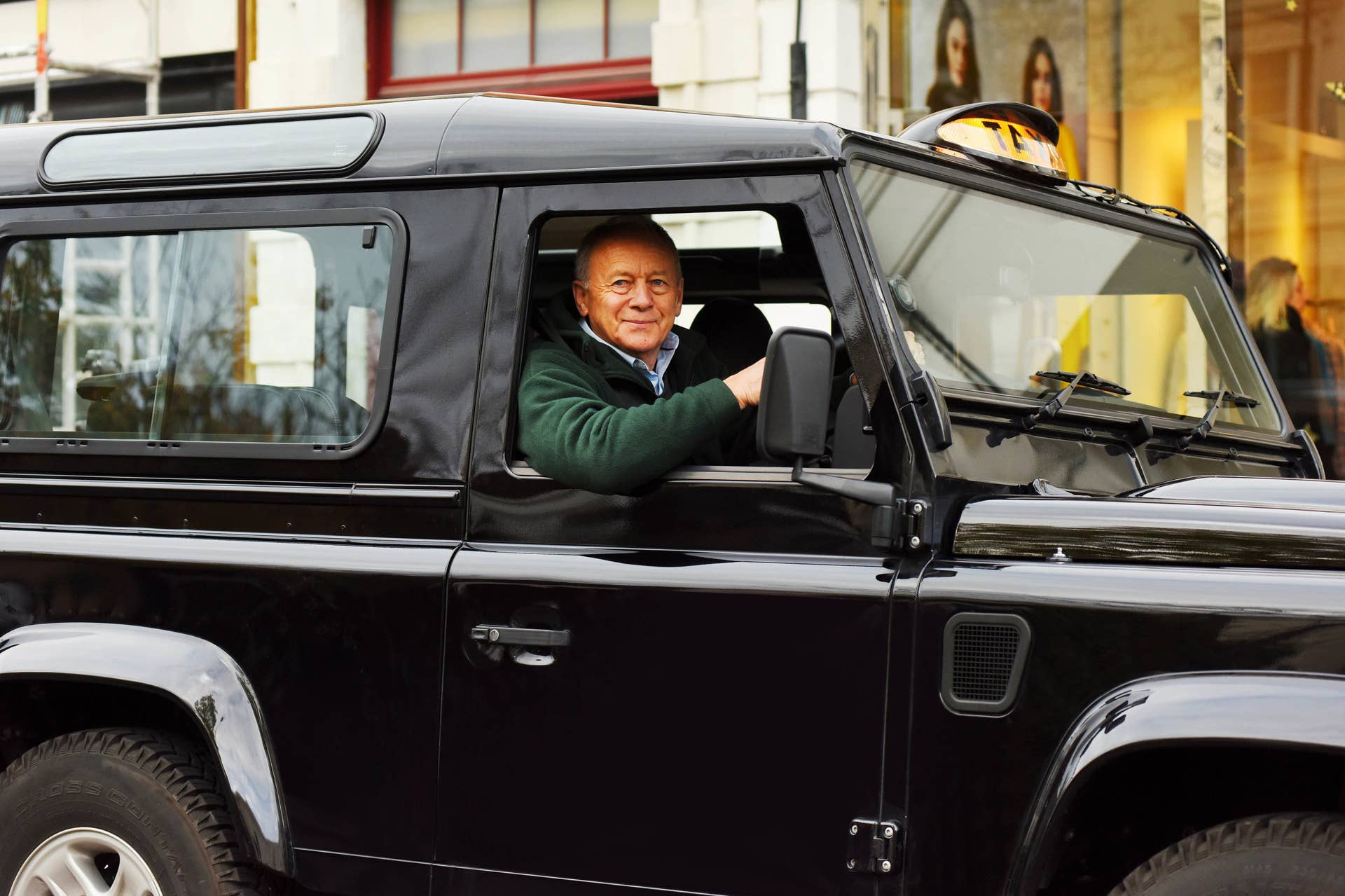 Land Rover Defender black cab taxi