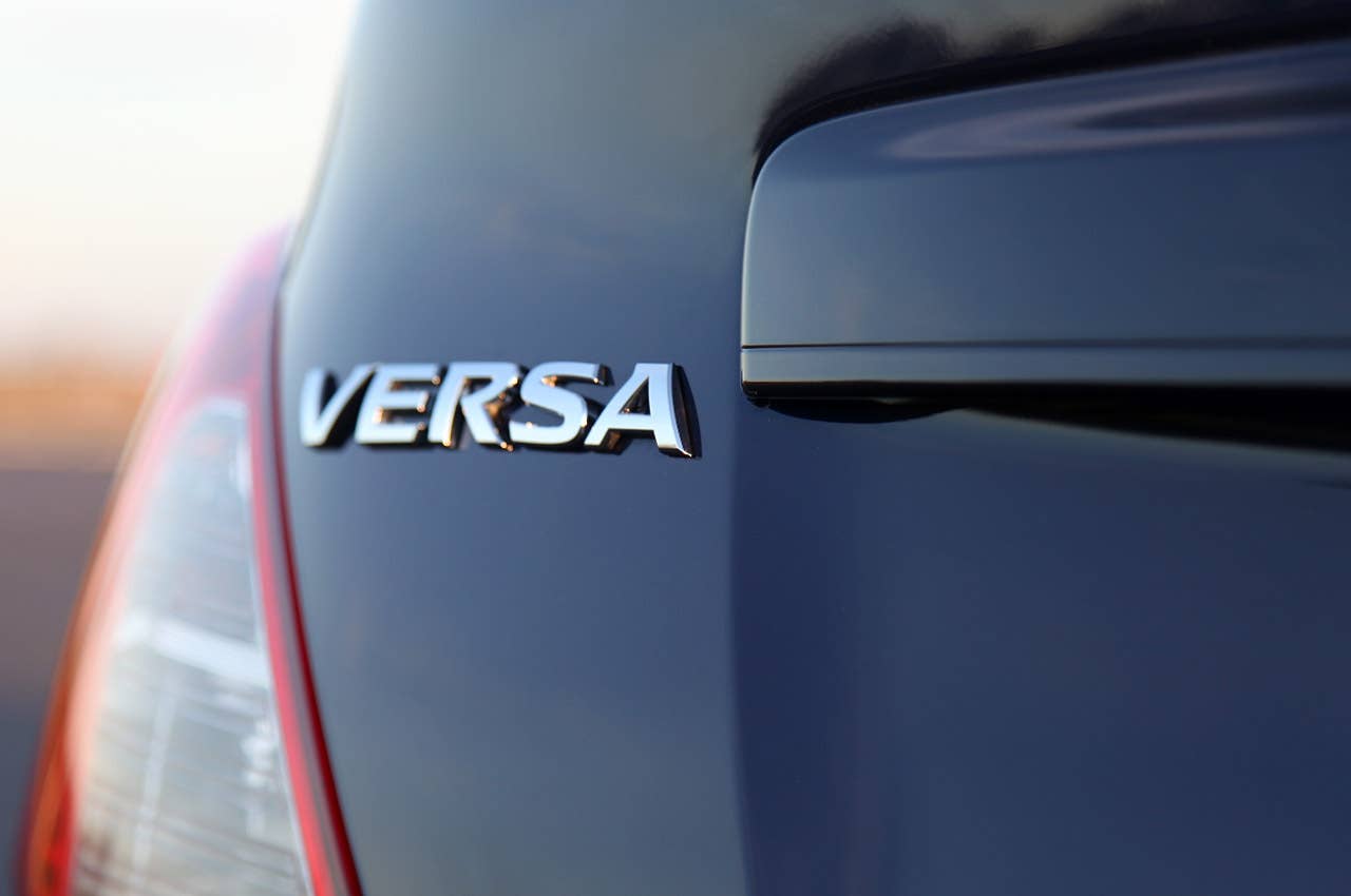 2012 Nissan Versa Sedan badge
