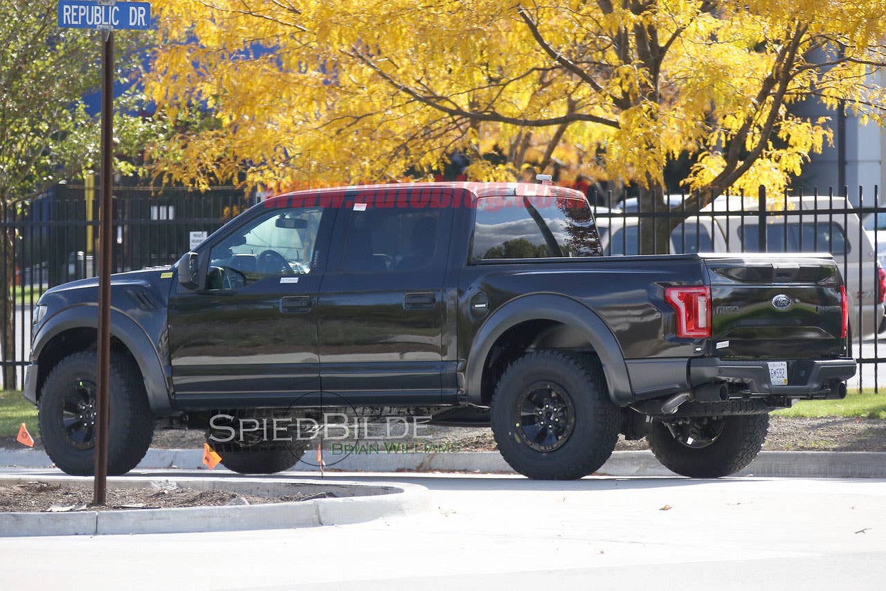 black 2017 ford f-150 raptor supercrew spy shot side flares