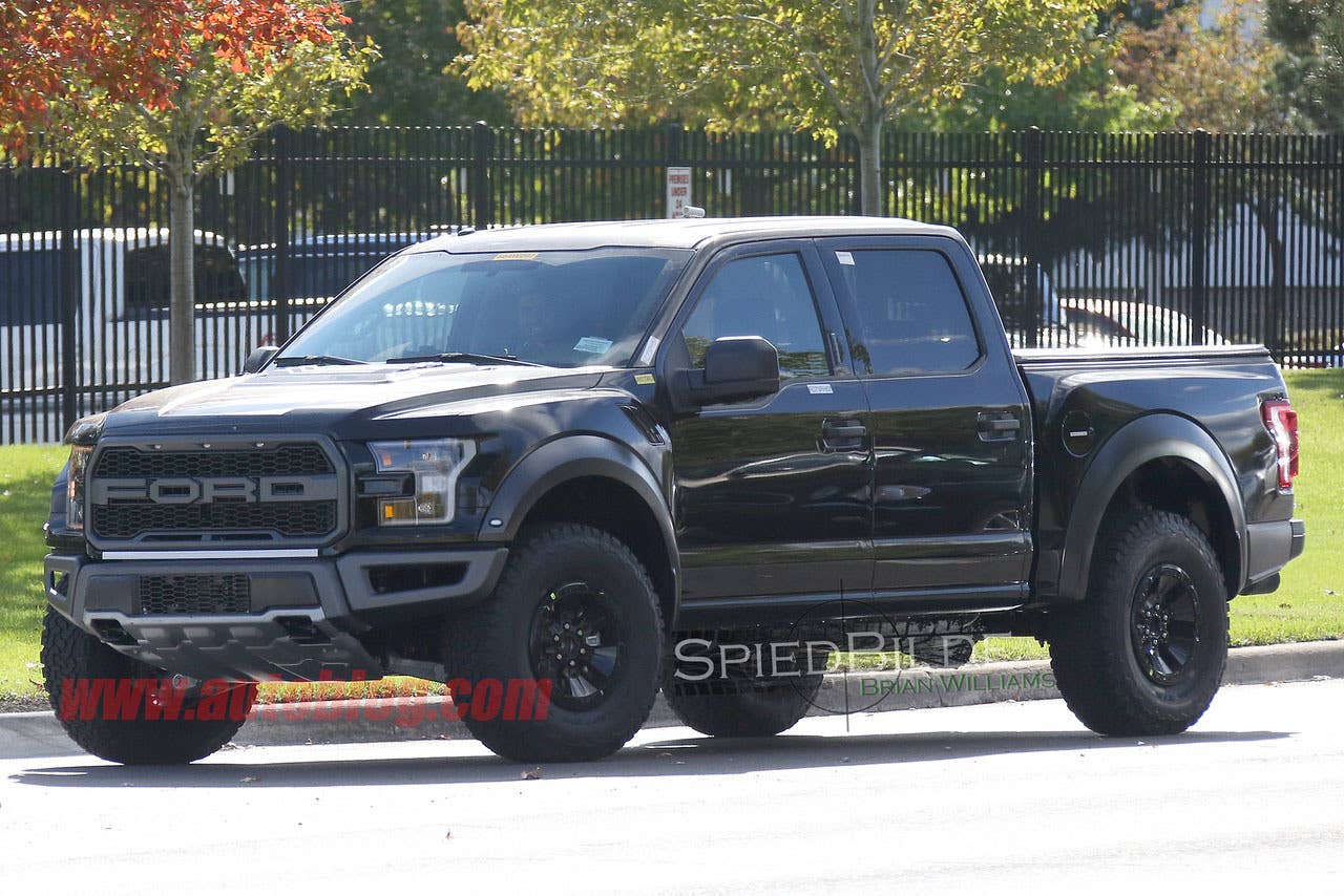 black 2017 ford f-150 raptor supercrew spy shot three quarters