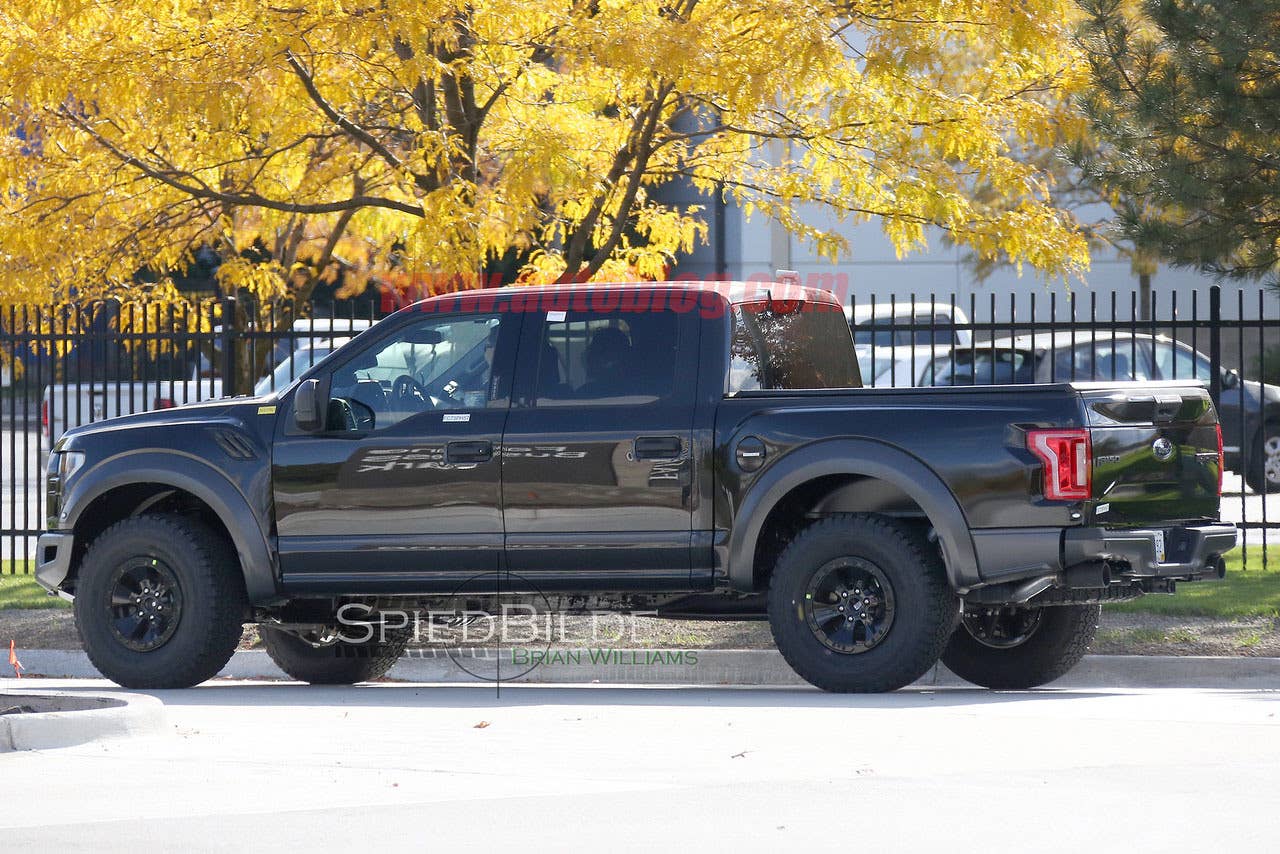black 2017 ford f-150 raptor supercrew spy shot rear three quarters