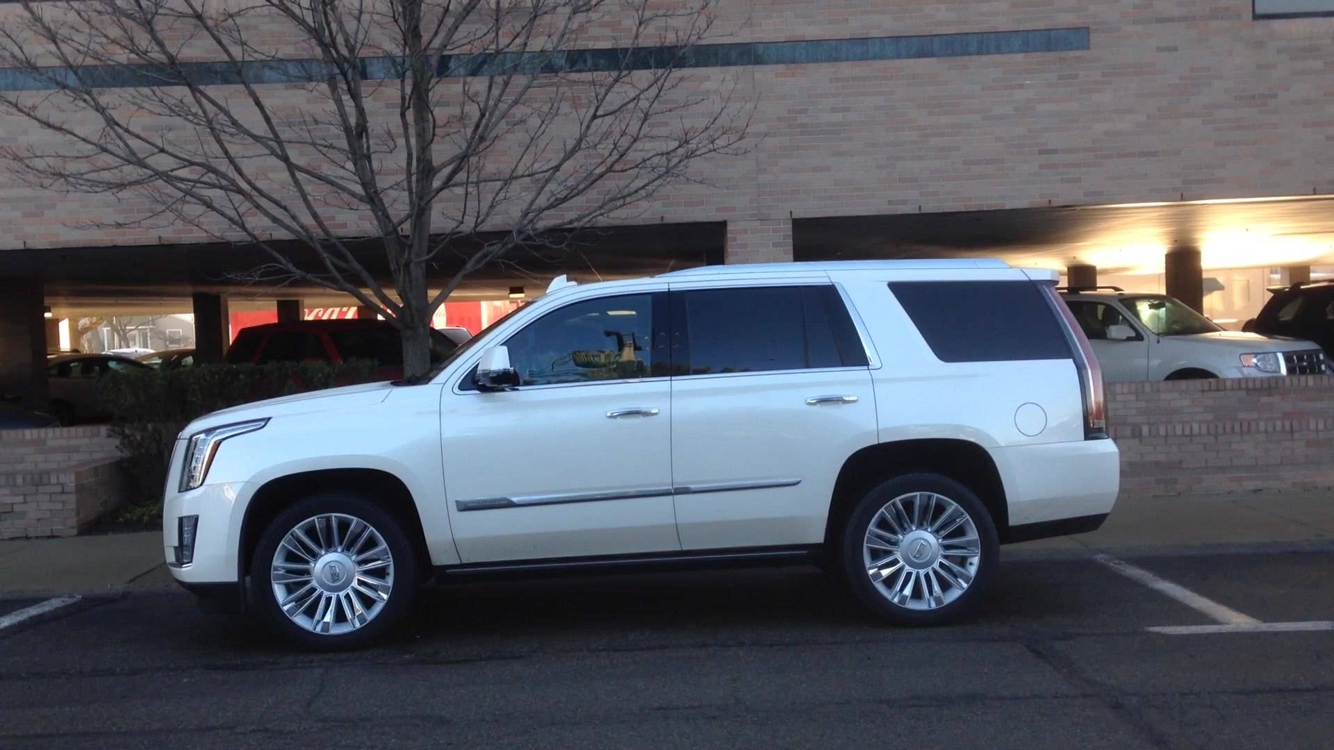 Senior editor Greg Migliore shows off the remote-start feature in the 2015 Cadillac Escalade.