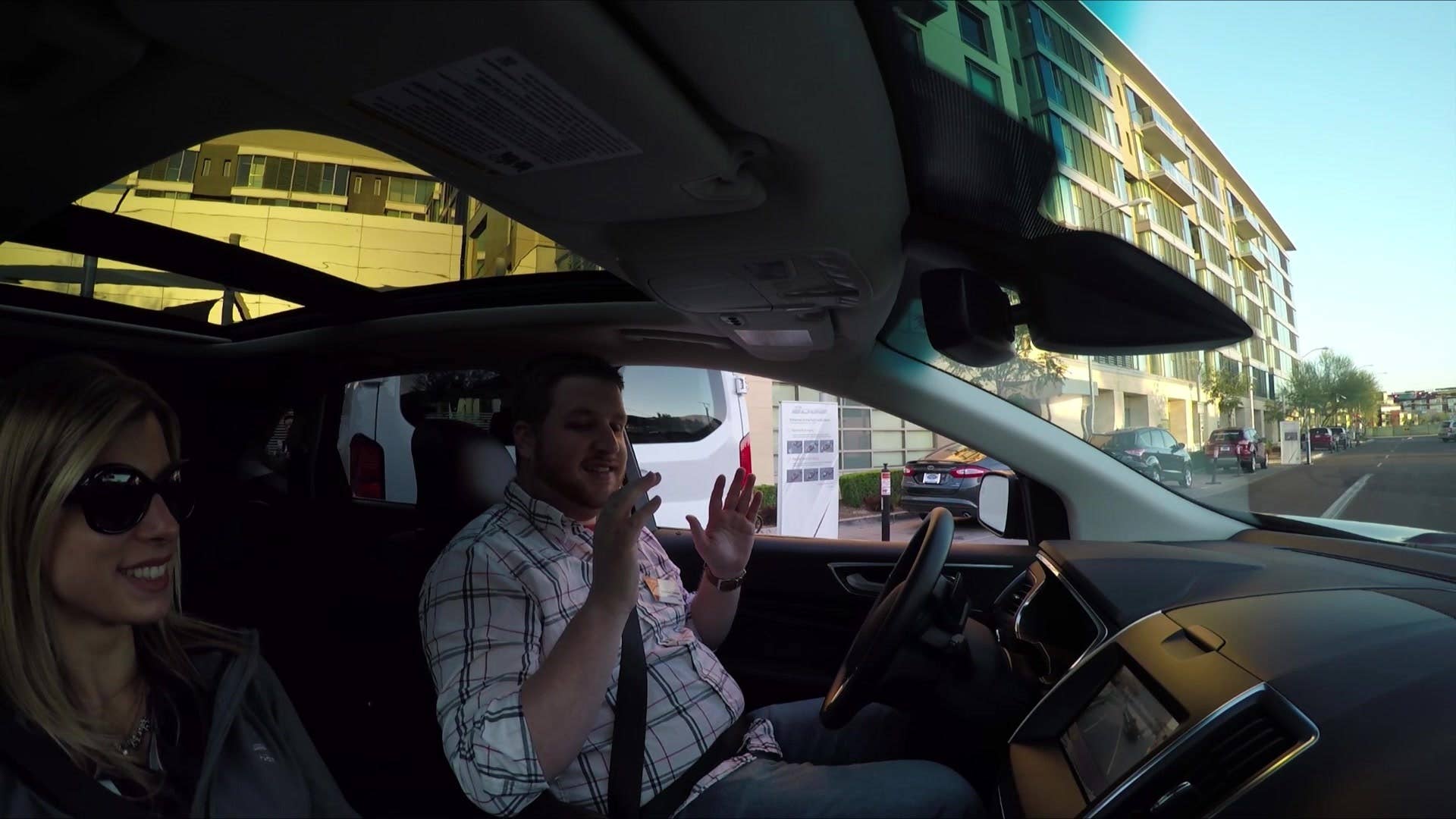 Associate Editor Brandon Turkus and Ford spokesperson Amanda Zusman test the Enhanced Park Assist System in a 2015 Ford Edge.